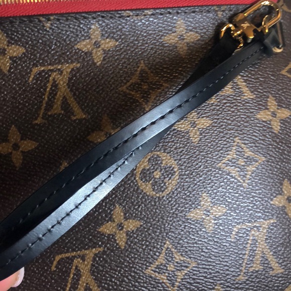 LV wristlet from World Tour collection. Authentic